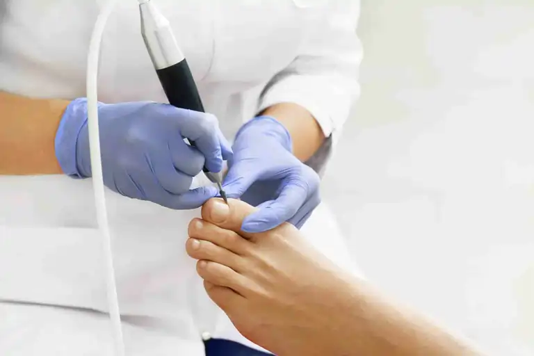 A podiatrist providing foot care to a patient.